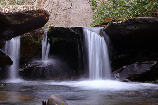 Slow Shutter Speed Waterfall Photography of a Small Fresh Water River in the Mountain Woods.