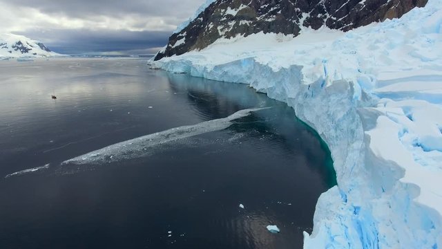 The flight of a drone over a bay surrounded by glaciers. Andreev.