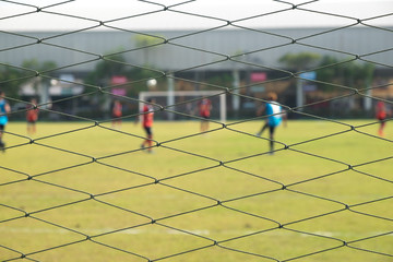 Behind goal of soccer field