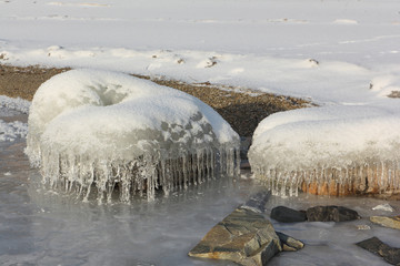 Icicles in  rime on a stone on a freezing river  , Ob reservoir, Siberia, Russia