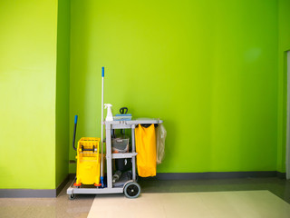 Cleaning tools cart wait for cleaning.Bucket and set of cleaning equipment in the office.