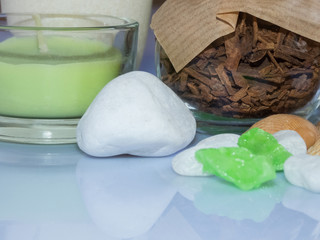 set ingredients and spice for aromatherapy and body care on a white surface with reflection. SPA still life