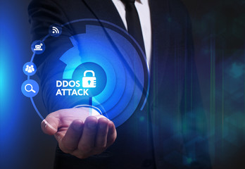Business, Technology, Internet and network concept. Young businessman working on a virtual screen of the future and sees the inscription: Ddos attack
