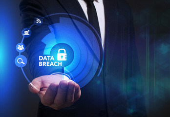 Business, Technology, Internet and network concept. Young businessman working on a virtual screen of the future and sees the inscription: Data breach