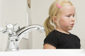 Bathroom Tap with Little Girl in the Background