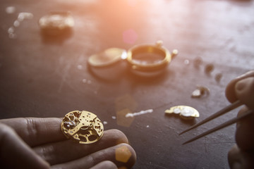 Watch maker is repairing a vintage automatic watch.