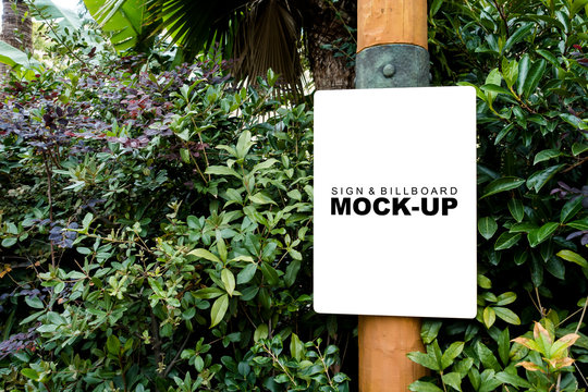 The mock up blank white screen banner on wooden pole