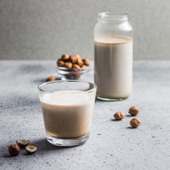 hazelnut cocoa milk in a glass. Selective focus, copy space, close up.