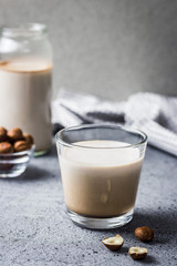 Homemade vegan hot chocolate in a glass. Selective focus, copy space, close up. 