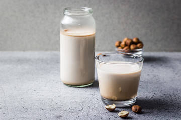 Vanilla cardamom hazelnut milk in a glass. Selective focus, copy space, close up. 