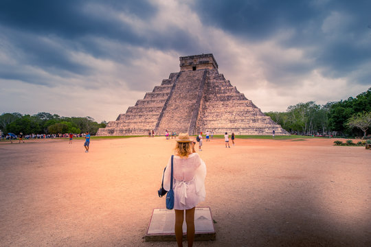 Girl watching a piramid in Chichen Itza ancient city - Mexico