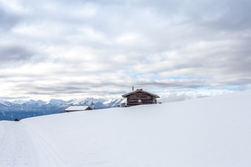 South tirol montains snow landscape and wooden cabin