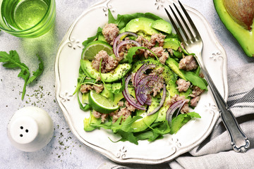 Tuna salad with avocado and arugula.Top view.