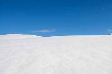 Fototapeta na wymiar Winter background snow and blue sky landscape in south tirol Italy