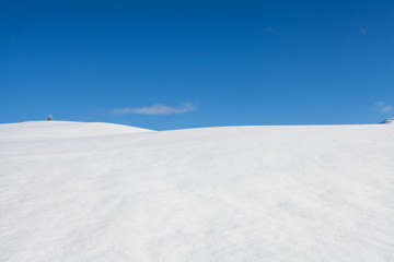 Winter background snow and blue sky landscape in south tirol Italy