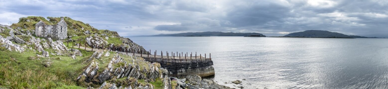 The rooten pier at craignish point with the Sound of Jura and the Islands of Scarba and Jura in the background
