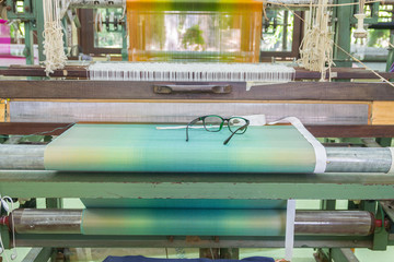 Detail of weaving loom for homemade silk or textile production