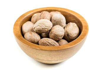 Pile of nutmeg seeds isolated on a white background