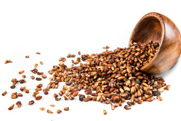Pile of dried pomegranate seeds isolated on a white background