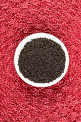 Dried basil seeds on a cloth background