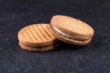 Stacks of cookies isolated on a black background
