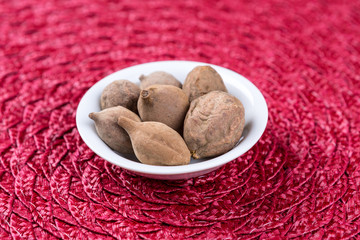 Pile of terminalia bellerica on a cloth background