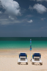 Beach chaise lounges and sea. St. George's, Grenada