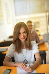 Confident female university student is taking the test