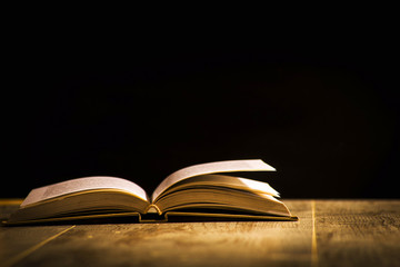 Concept sciences at the school, book on the black background