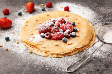 Tasty buckwheat thin pancakes on table