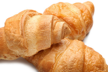 Delicious croissants on white background