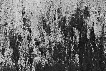 Rusty metal wall texture in black and white.