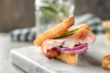 Delicious sandwich on marble board, closeup