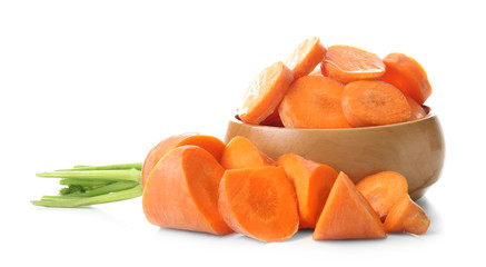 Wooden bowl with cut carrot on white background
