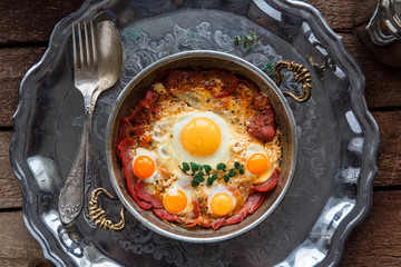 Top view of fried eggs with cured meat, turkish breakfast pastirmali yumurta