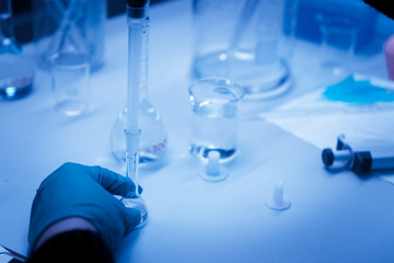 The scientists injected chemicals into plastic tubes,Scientist mix chemicals with The shake machine Before the experiment.Mixture laced with samples into test tubes,prepare sample for test