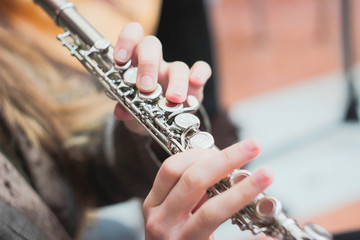 A girl plays a flute