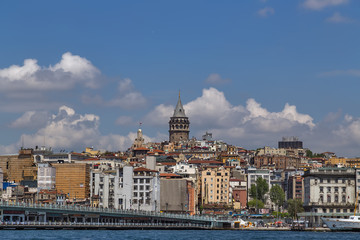 Fototapeta premium Cityscape summer sea front view with Galata Tower and Gulf of the Golden Horn in Istanbul, Turkey.