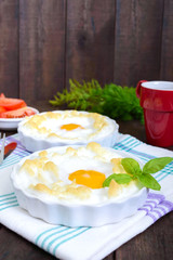 Delicate baked egg Orsini (eggs in the cloud). French breakfast.