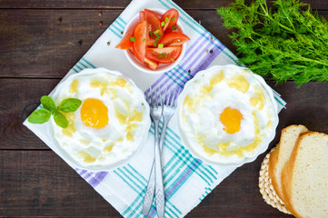 Delicate baked egg Orsini (eggs in the cloud). French breakfast. The top view