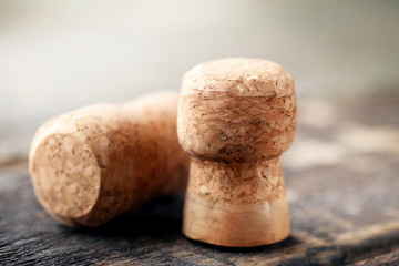 Champagne corks on grey wooden table