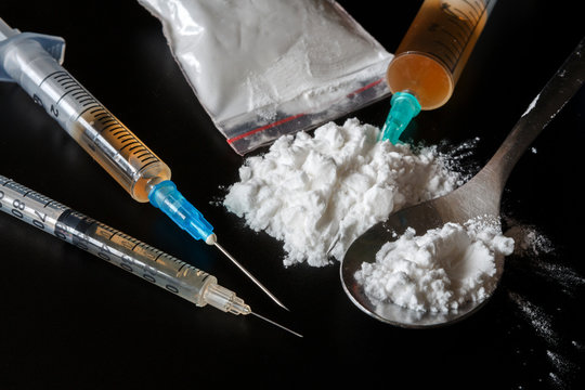 Drug Heroin, Syringes, Money On A Dark Background With Copy Space, Concept Of Crime And Addiction