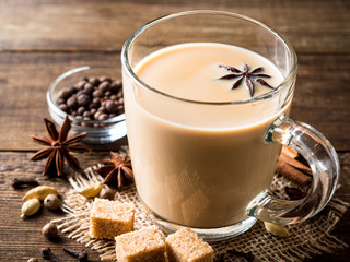 Indian masala chai on rustic wooden table