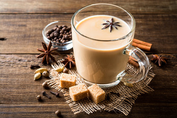 Indian masala chai on rustic wooden table