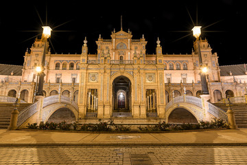 Naklejka premium Spain Square (Plaza de Espana) at night, Seville, Spain, built on 1928, it is one example of the Regionalism Architecture mixing Renaissance and Moorish styles