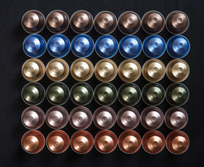 Espresso coffee pods isolated on black background, Top view