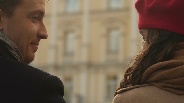 Attractive couple shy on first date, awkward situation, looking at each  other