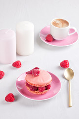 Romantic breakfast with coffee and pink raspberry macaron
