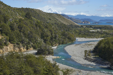 Fototapeta na wymiar Rio los Maintenes flowing into the clear blue waters of Lago General Carrera in northern Patagonia, Chile 