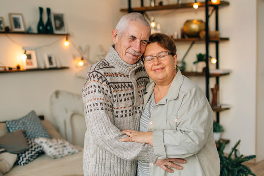 Happy Senior couple in love hugging. Cheerful mature woman with husband.